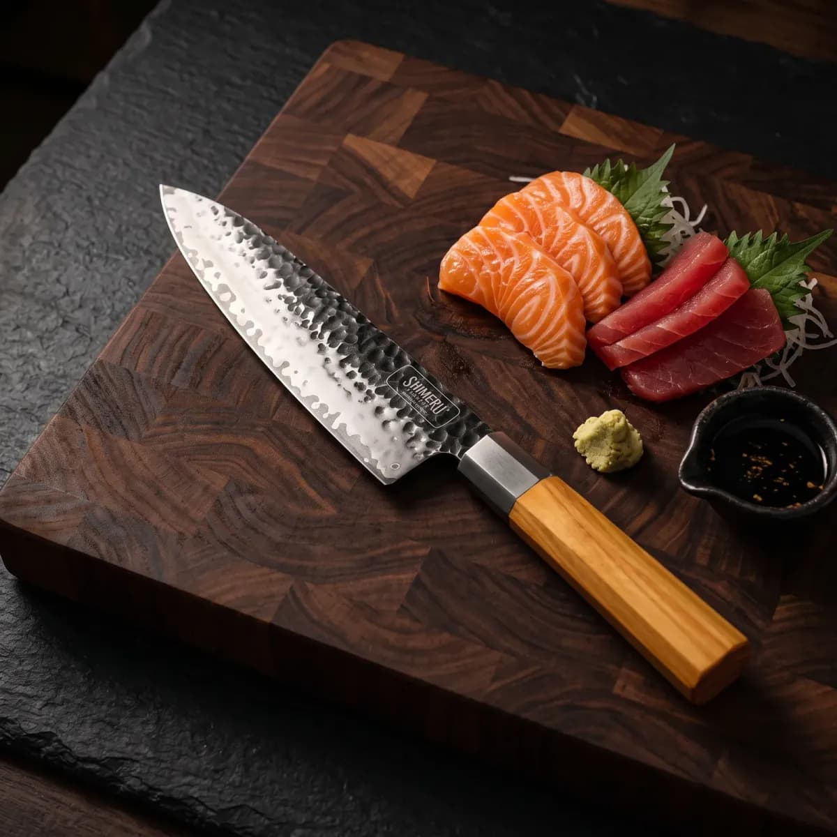 Kakehashi 8" Gyuto beside sliced salmon and tuna sashimi