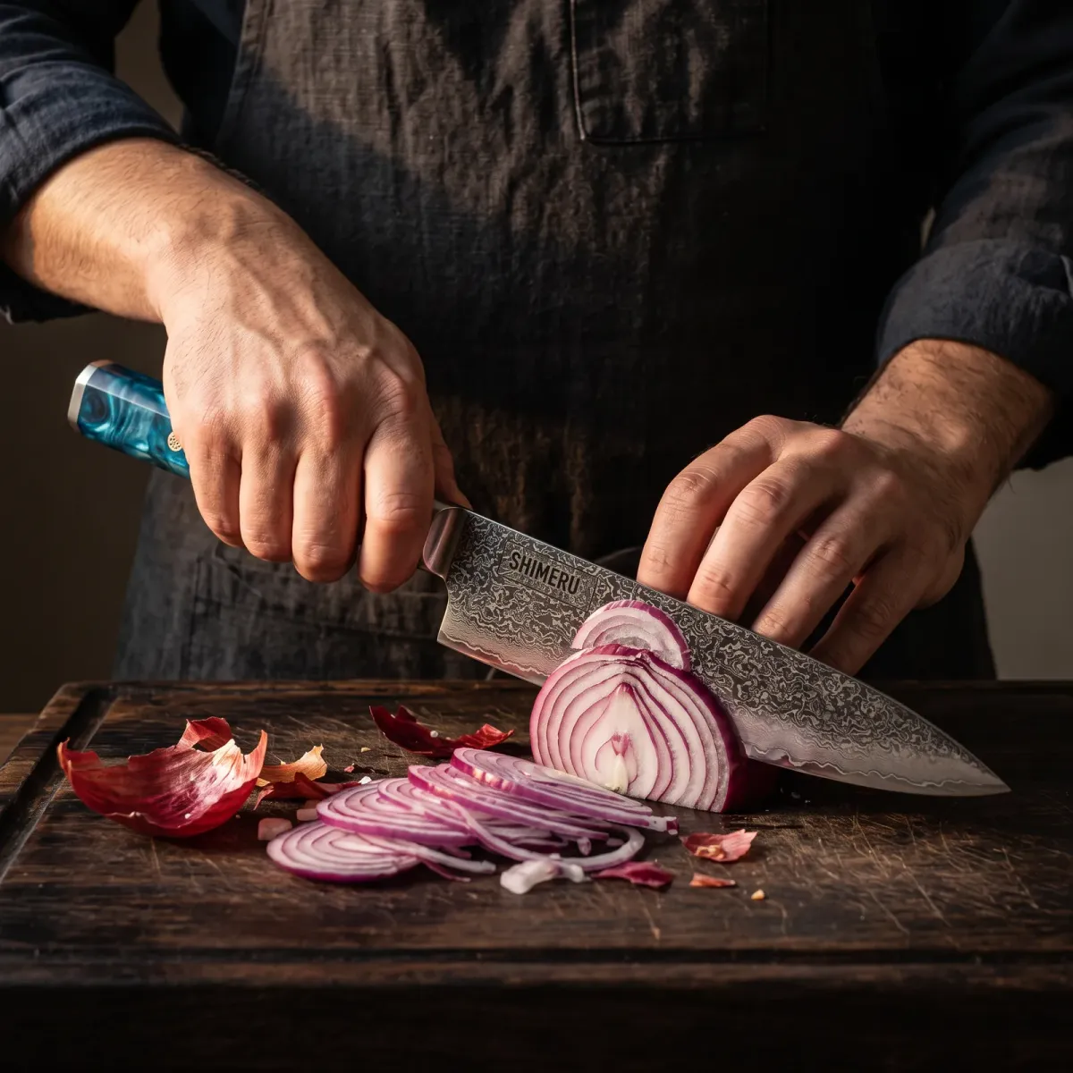 Mogami 8" Damascus Steel Gyuto Knife slicing a red onion paper thin