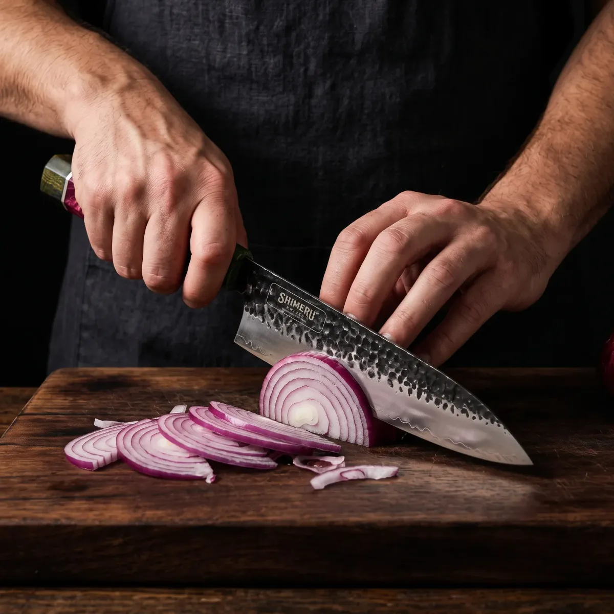 Natori 8" Gyuto Knife slicing a red onion paper thin