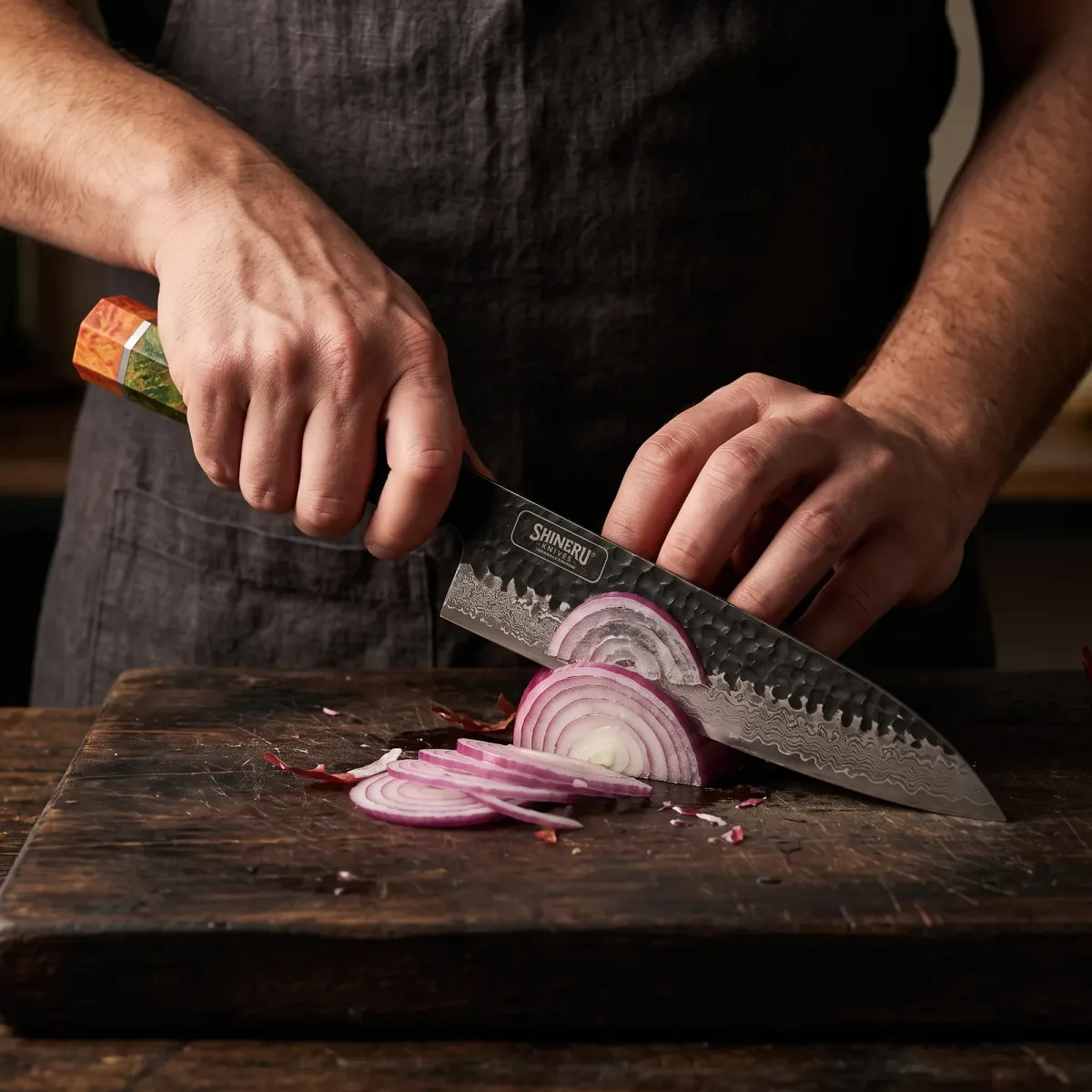 Yoshii 8 Damascus Steel Gyuto Knife slicing a red onion paper thin