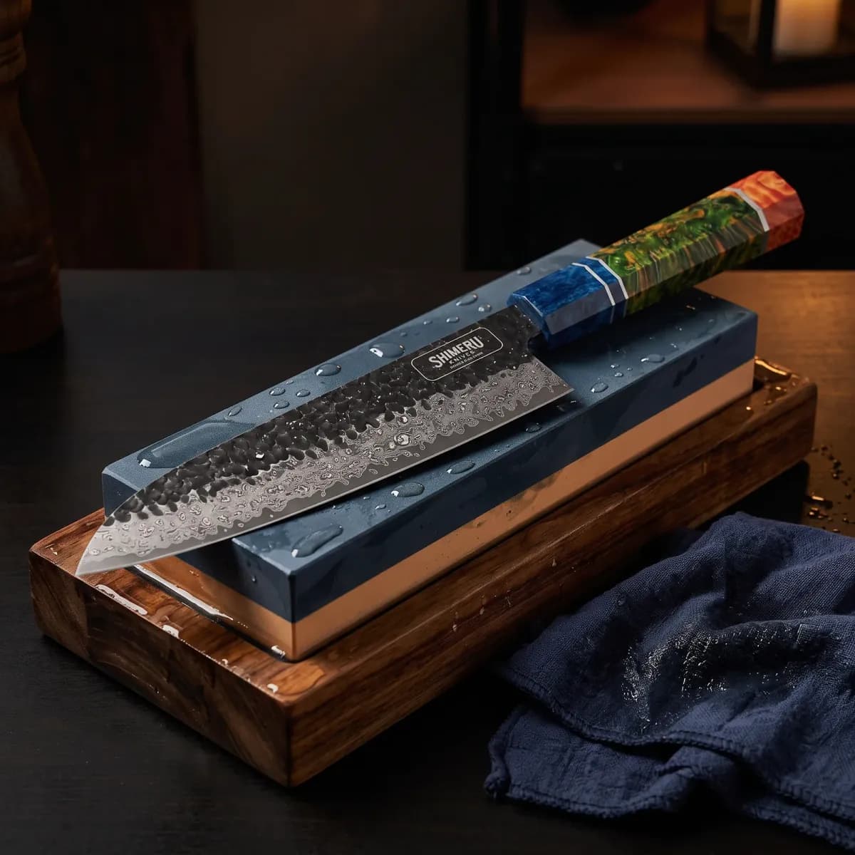 Yoshii 8 Damascus Steel Gyuto Knife being sharpened on a wet whetstone