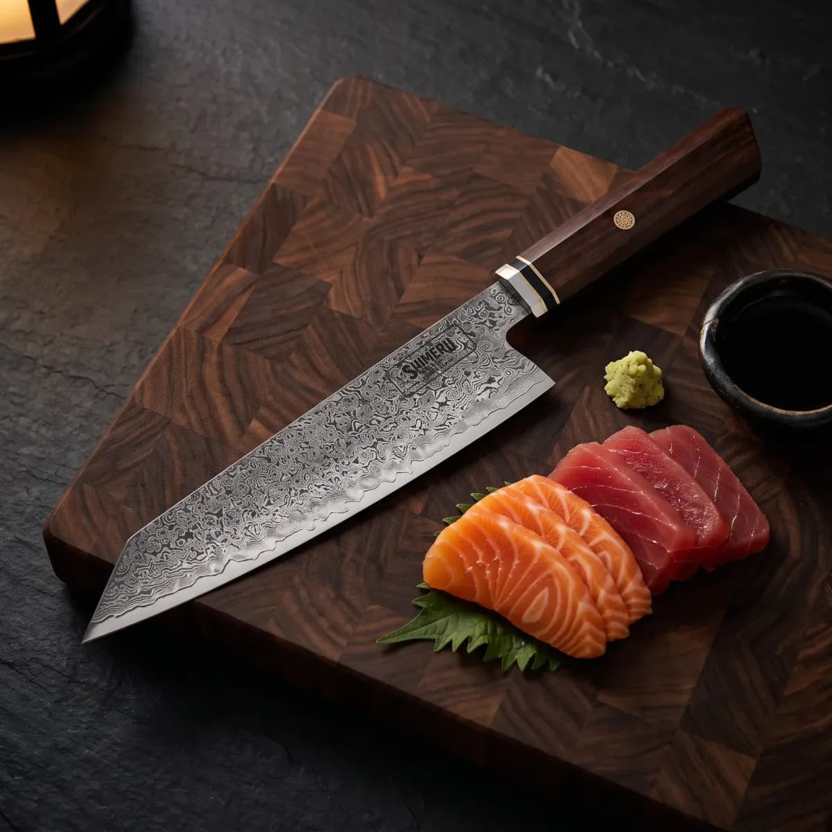 Tenryu 8" Damascus Steel Kiritsuke Knife beside sliced salmon and tuna sashimi