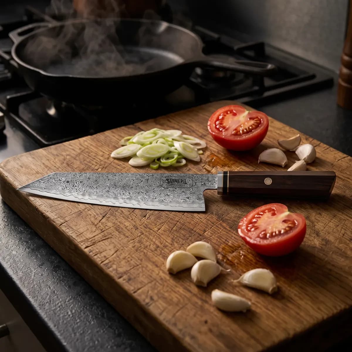 Tenryu 8" Damascus Steel Kiritsuke Knife on an oak board with spring onions, tomato and garlic