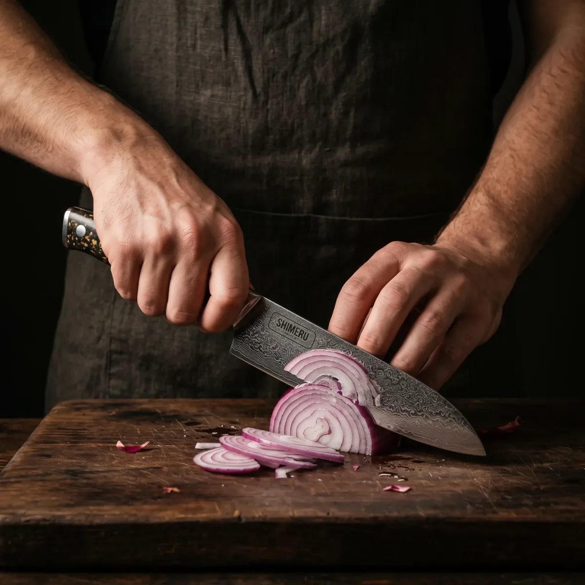 Asuka 7 Damascus Steel Santoku Knife slicing a red onion paper thin