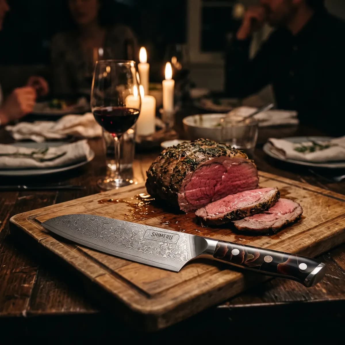 Hayama 7 Damascus Steel Santoku Knife on a carving board beside sliced roast beef at a candlelit dinner