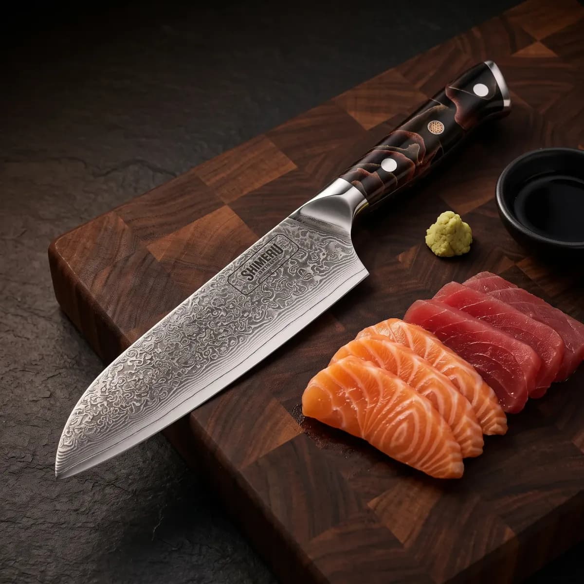 Hayama 7 Damascus Steel Santoku Knife beside sliced salmon and tuna sashimi