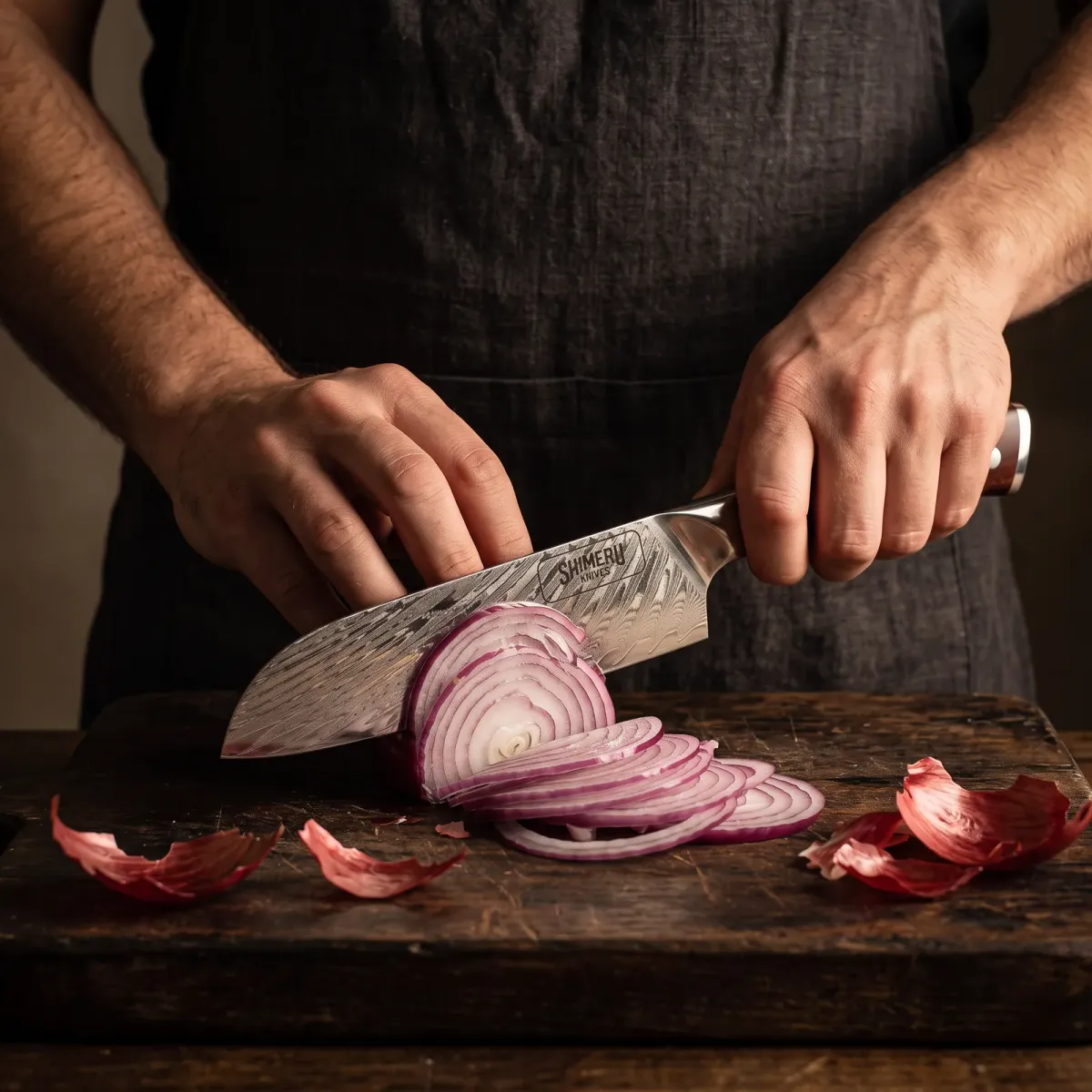 Mizuki 7 Damascus Steel Santoku Knife slicing a red onion paper thin