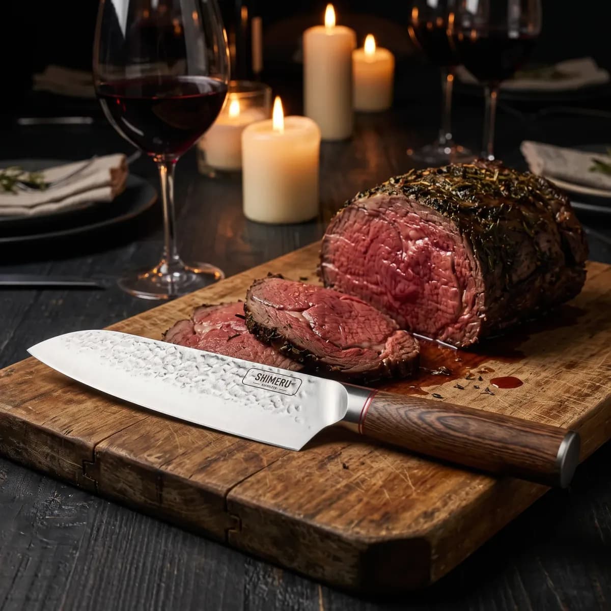 Raikou 6.5" Santoku Knife on a carving board beside sliced roast beef at a candlelit dinner